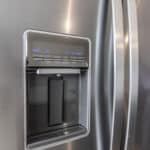 The James Apartments | Close-up of a stainless steel refrigerator with a built-in water and ice dispenser, featuring control settings | Luxury Apartments in Haverhill MA