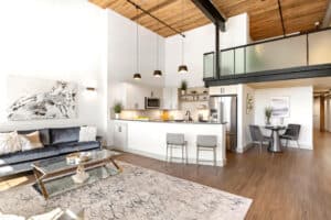 a living room with a kitchen and dining area